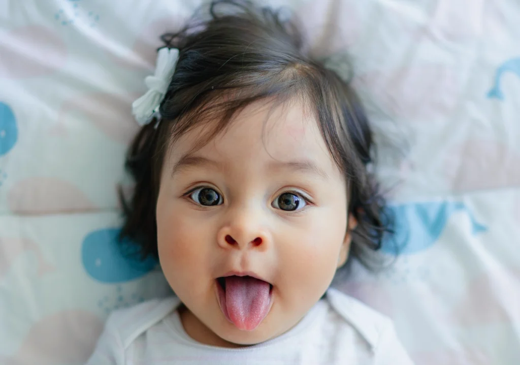toddler spitting Toddler with tongue out